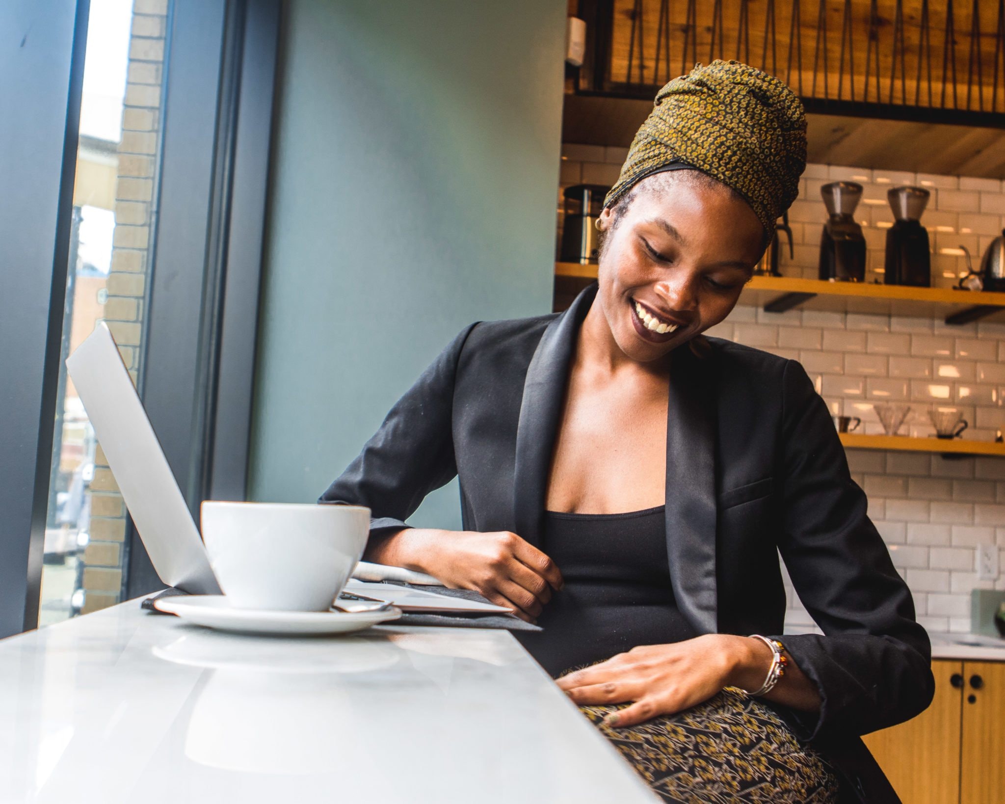 smiling woman working at coffee shop