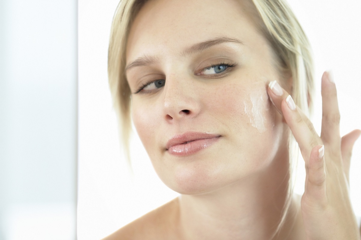 Simply Smooth - Woman Applying Moisturizer