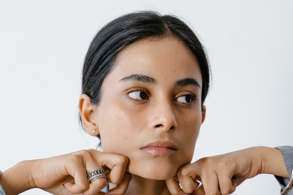 woman stretching jaw skin