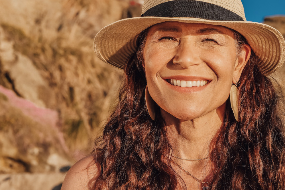 woman in sunhat on the beach