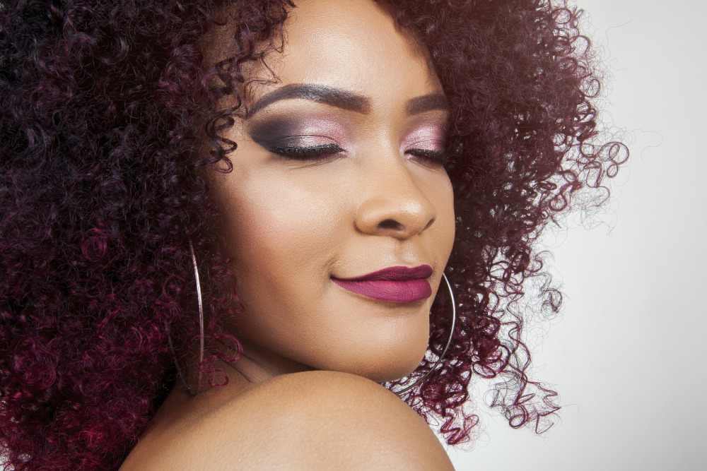 Close up of a model with makeup and flawless skin.